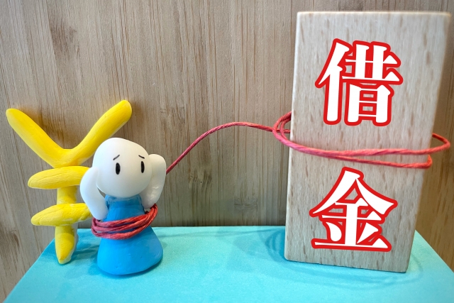 お金を手に頭を抱える。御殿場市で債務整理の無料相談ができます